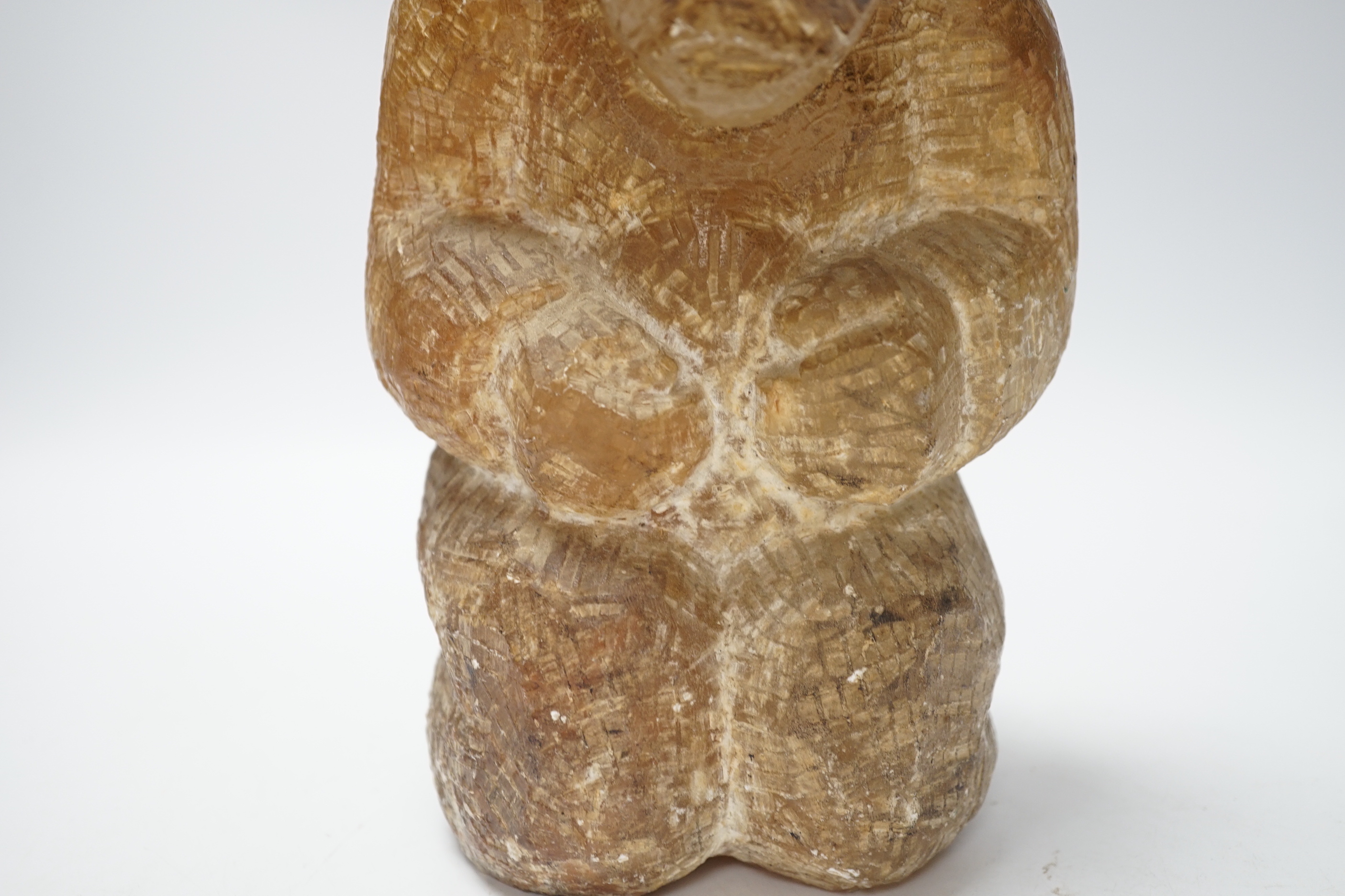A soapstone Inuit carved figure, 22cm high